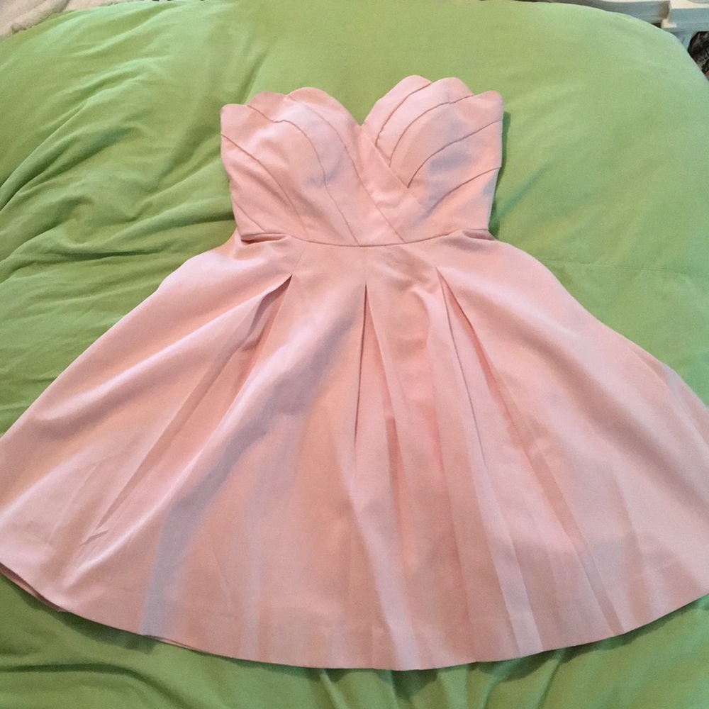 Pink strapless dress.